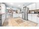 Modern kitchen with stainless steel appliances and white cabinets at 509 Oakhurst St, Brandon, FL 33511