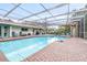 Inviting screened pool with brick patio and covered lanai at 509 Oakhurst St, Brandon, FL 33511