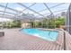 Inviting screened pool with brick patio and covered lanai at 509 Oakhurst St, Brandon, FL 33511