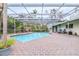 Inviting screened pool with brick patio and covered lanai at 509 Oakhurst St, Brandon, FL 33511