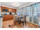 Bright dining area with wood floors and window seating at 5322 Comanche St, Zephyrhills, FL 33542