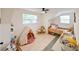 Charming bedroom with a teepee, built in shelves, and a daybed at 5816 Woodrow Wilson Ne Blvd, St Petersburg, FL 33703