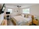 Spacious main bedroom with a king-size bed and built-in workspace at 5816 Woodrow Wilson Ne Blvd, St Petersburg, FL 33703