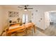 Light and airy dining area with wooden table and chairs at 5816 Woodrow Wilson Ne Blvd, St Petersburg, FL 33703