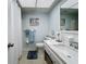 Updated bathroom with a white vanity and tiled flooring at 5890 38Th N Ave # 101, St Petersburg, FL 33710