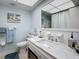 Clean bathroom, featuring a large vanity with a marble countertop at 5890 38Th N Ave # 101, St Petersburg, FL 33710