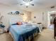 Bedroom with a queen bed and coastal-themed decor at 5890 38Th N Ave # 101, St Petersburg, FL 33710