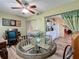 Charming dining area with a glass table and wicker chairs at 5890 38Th N Ave # 101, St Petersburg, FL 33710