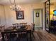 Classic dining room with wood table and chandelier at 5890 38Th N Ave # 101, St Petersburg, FL 33710