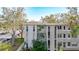 Side view of the condo building showcasing its architectural details and landscaping at 5890 38Th N Ave # 101, St Petersburg, FL 33710