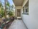 Private condo entrance with a welcoming porch and charming landscaping at 5890 38Th N Ave # 101, St Petersburg, FL 33710