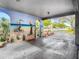 Covered carport with beach-themed mural, offering shade and a unique aesthetic at 5890 38Th N Ave # 101, St Petersburg, FL 33710