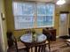 Small dining area with a round table and four chairs at 5890 38Th N Ave # 101, St Petersburg, FL 33710