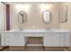 Bathroom with double vanity and updated light fixtures at 599 Centerwood Dr, Tarpon Springs, FL 34688