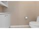 Simple half bathroom with white vanity and toilet at 599 Centerwood Dr, Tarpon Springs, FL 34688