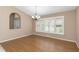 Simple dining room with wood flooring and neutral walls at 599 Centerwood Dr, Tarpon Springs, FL 34688