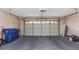 Spacious garage with overhead door and ample storage space at 599 Centerwood Dr, Tarpon Springs, FL 34688