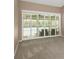 Gathering room with sliding doors leading to pool area at 599 Centerwood Dr, Tarpon Springs, FL 34688