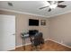 Home office features built-in shelving and hardwood floors at 599 Centerwood Dr, Tarpon Springs, FL 34688