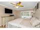 Large main bedroom with sliding doors to pool at 599 Centerwood Dr, Tarpon Springs, FL 34688