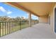 Spacious outdoor balcony offers a peaceful view of the surrounding greenery at 6307 Brevada Ln, Apollo Beach, FL 33572