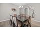 Formal dining room boasts hardwood floors and a stylish chandelier above the table at 6307 Brevada Ln, Apollo Beach, FL 33572