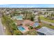 Aerial view of house with pool and neighborhood at 6327 5Th Street E Cir, Bradenton, FL 34203