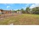 Fenced backyard with shed and grassy area at 6327 5Th Street E Cir, Bradenton, FL 34203