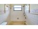 Bathroom with beige tile and a shower/tub combo at 6327 5Th Street E Cir, Bradenton, FL 34203