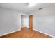 Bedroom with wood-look floors, closet, and neutral walls at 6327 5Th Street E Cir, Bradenton, FL 34203