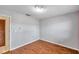 Simple bedroom with wood-look floors and neutral walls at 6327 5Th Street E Cir, Bradenton, FL 34203