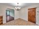 Dining room with tiled floors and a chandelier, offering access to other rooms at 6327 5Th Street E Cir, Bradenton, FL 34203