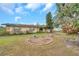 Landscaped front yard with a single-story house and attached garage at 6327 5Th Street E Cir, Bradenton, FL 34203