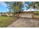 Front view of a single-story house with a paved driveway at 6327 5Th Street E Cir, Bradenton, FL 34203