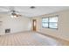 Living room with tiled floors and a view of the front door and window at 6327 5Th Street E Cir, Bradenton, FL 34203