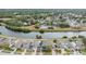 Wide aerial view of houses and a canal at 6931 Silvermill Dr, Tampa, FL 33635