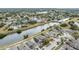 Aerial view of a residential community with houses, canals, and lush green areas at 6931 Silvermill Dr, Tampa, FL 33635