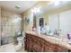 Primary bathroom with dual vanities and a walk-in shower at 6931 Silvermill Dr, Tampa, FL 33635