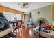 Dining area with wood floors and a view of the living room at 6931 Silvermill Dr, Tampa, FL 33635