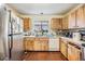 Kitchen with stainless steel appliances and wood cabinets at 6931 Silvermill Dr, Tampa, FL 33635