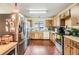 Kitchen with stainless steel appliances and wood cabinets at 6931 Silvermill Dr, Tampa, FL 33635