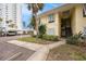 Condo building with stairs leading to unit entrance at 7300 Sunshine Skyway S Ln # 108, St Petersburg, FL 33711