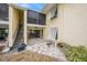 Back patio with stairs leading to the second floor at 7300 Sunshine Skyway S Ln # 108, St Petersburg, FL 33711