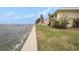 Waterfront property with seawall and grassy area at 7300 Sunshine Skyway S Ln # 108, St Petersburg, FL 33711