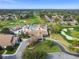 Aerial view of community clubhouse, pool, and golf course at 7473 Willow Brook Dr, Spring Hill, FL 34606