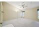 Spacious bedroom with ceiling fan and carpeted floors at 7473 Willow Brook Dr, Spring Hill, FL 34606