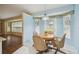 Cozy breakfast nook with light blue walls and a wooden table at 7473 Willow Brook Dr, Spring Hill, FL 34606