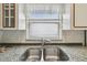 Modern double sink with granite countertop in the kitchen at 7473 Willow Brook Dr, Spring Hill, FL 34606