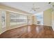 Spacious living room featuring hardwood floors and large windows at 7473 Willow Brook Dr, Spring Hill, FL 34606