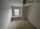 Bright bedroom featuring a window seat and ceiling fan at 7533 Merchantville Cir, Zephyrhills, FL 33540